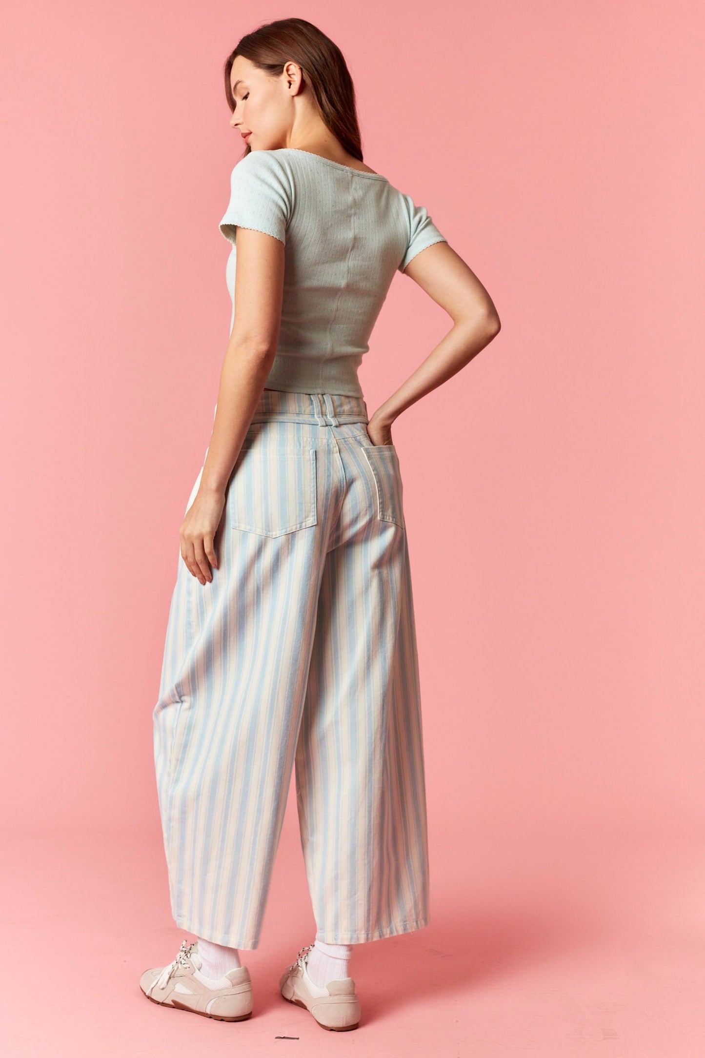 Women wearing a blue and white stripe barrel pants