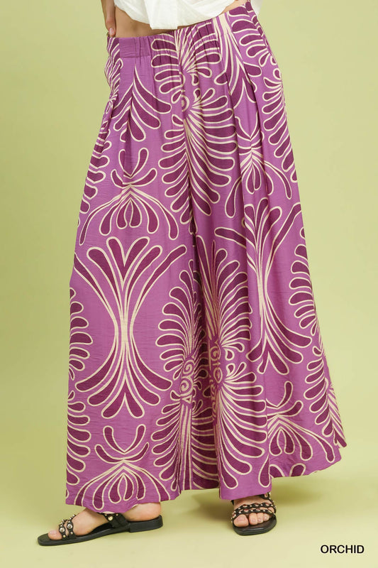 Purple patterned pants on a green background