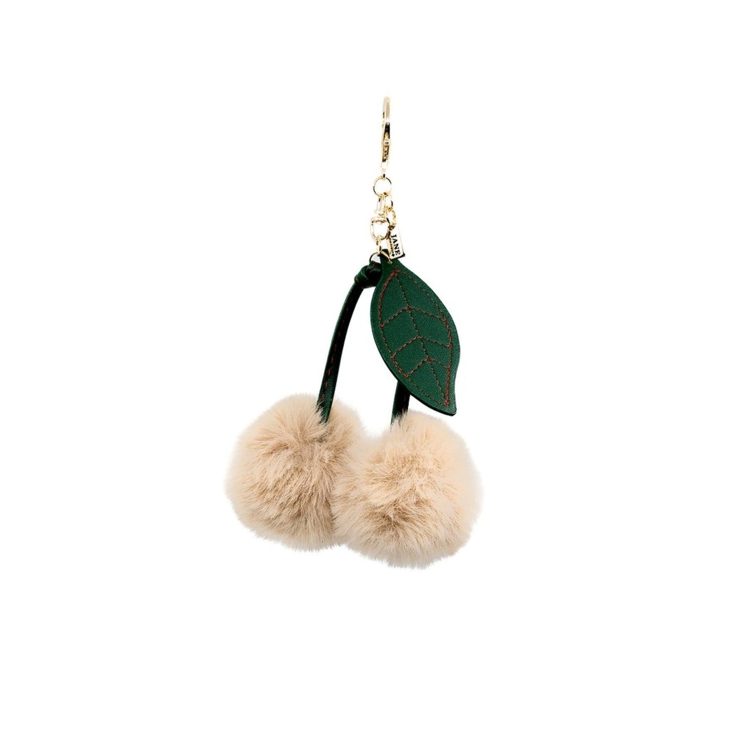 Keychain with fluffy pom-poms and a leaf design on a white background