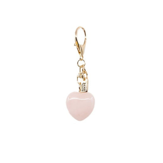 Pink heart-shaped charm with gold clasp on a white background