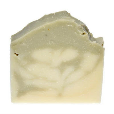 a shea butter and french green clay soap on a white background.