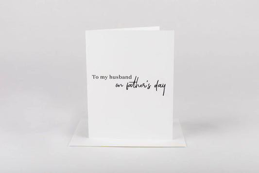 Greeting card with 'To my husband on father's day' text on a white background