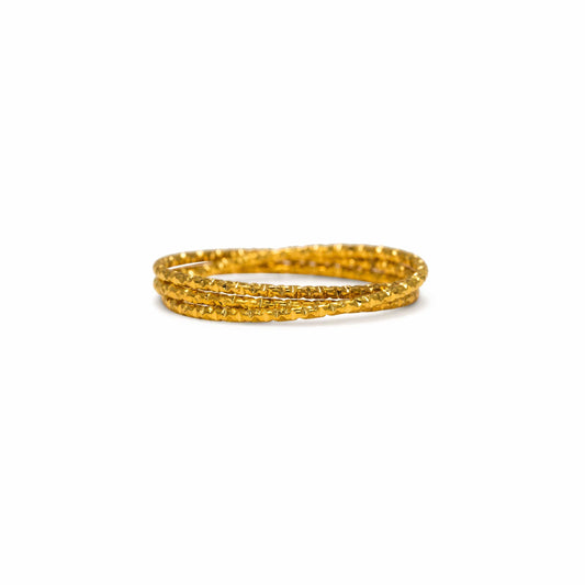 Two gold rings on a white background