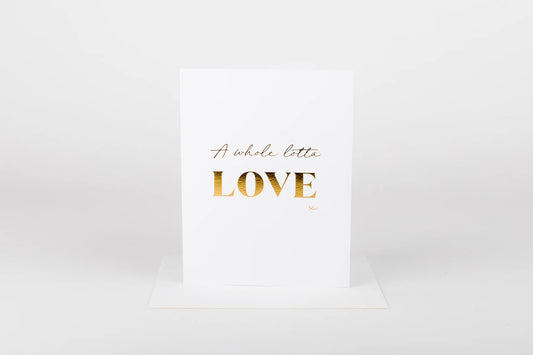 White card with gold text 'A whole lotta LOVE' on a white background