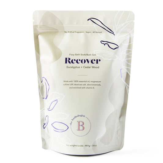 White packaging of 'Recover' bath soaks with branding on a white background
