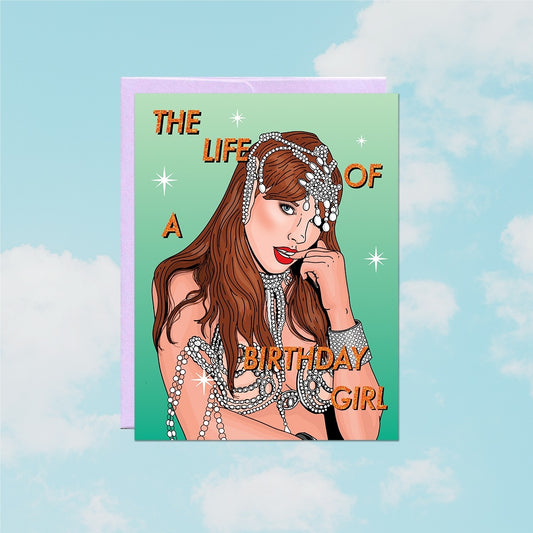 Greeting card with a stylized illustration of a woman in sparkling jewelry against a blue sky background.
