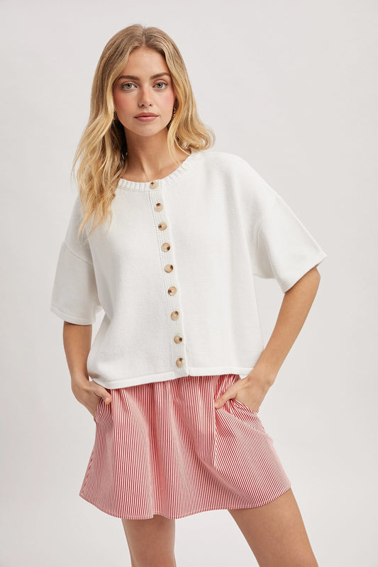 Women wearing a short sleeve button up cardi