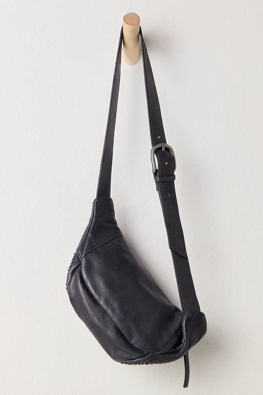 Black leather bag with a strap on a white background