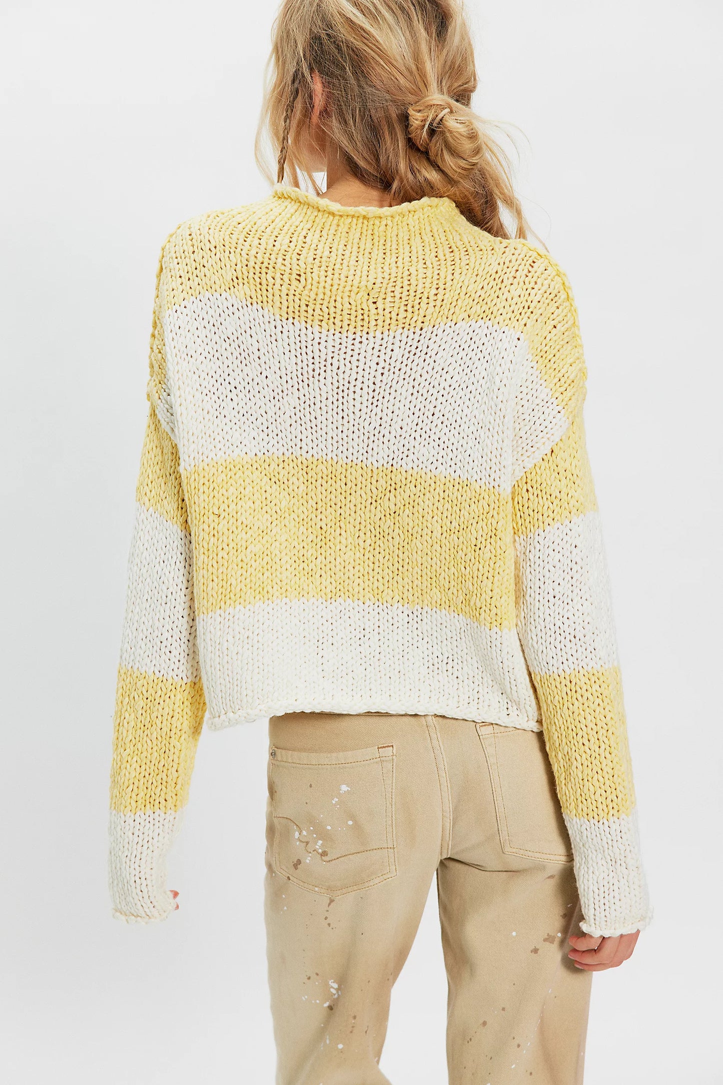 women wearing a yellow & white Stripe sweater