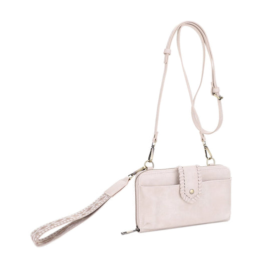 a cream velvet wallet purse with a boho guitar strap.