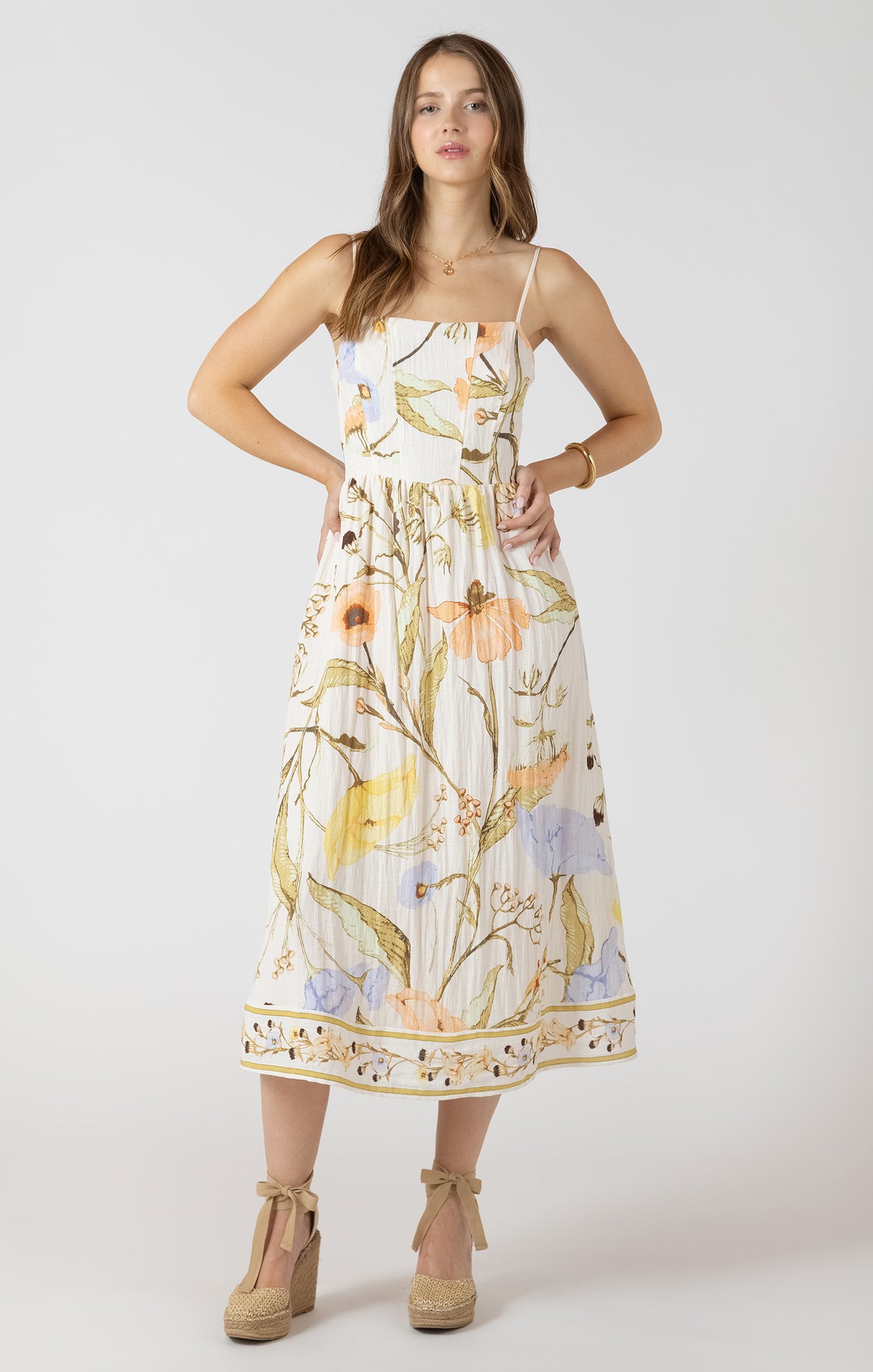 Woman wearing a floral dress on a white background