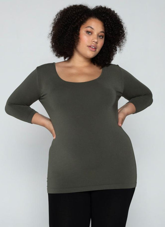 A woman wearing a Curvy bamboo 3/4 sleeve top.
