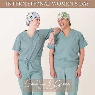 two women wearing a doctors scrubs celebrating international womens day