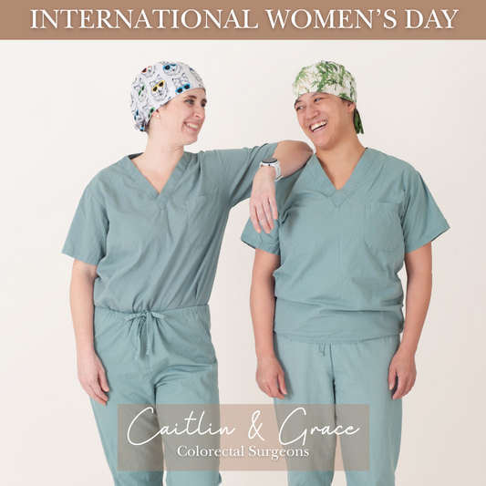 two women wearing a doctors scrubs celebrating international womens day