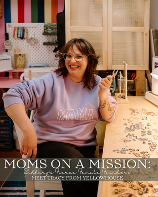 a women wearing a mama sweatshirt in her design studio