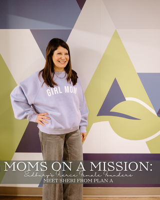 a women wearing a girl mom sweatshirt