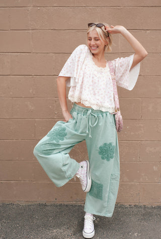 Women wearing mint green floral patches throughout