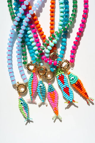 beaded necklaces with a beaded fish pendant.