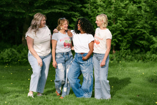 Women in a garden wearing blue jeans. 