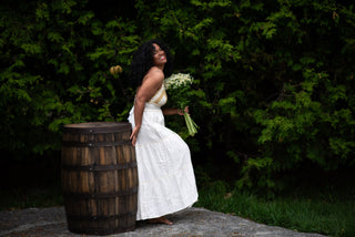 Women wearing a white dress in a garden