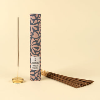 Incense stick with packaging on a beige background