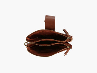 Brown leather handbag with multiple zippers on a white background