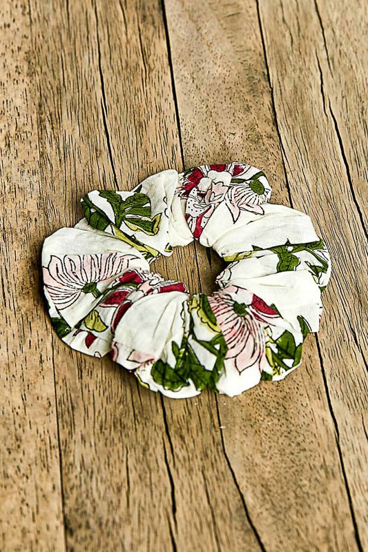 Floral scrunchies on a wooden surface