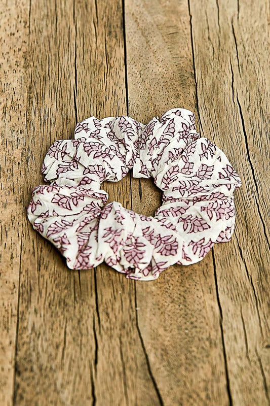 Floral patterned scrunchie on a wooden surface