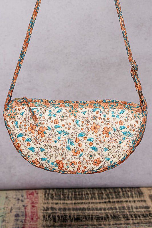 Floral patterned handbag on a gray background