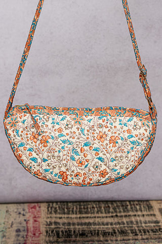 Floral patterned handbag on a gray background