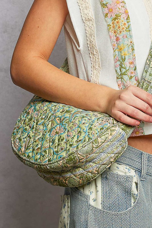 women wearing a quilted bag