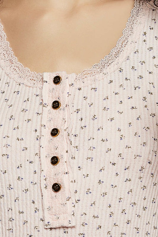 Close-up of a floral-patterned top with button details