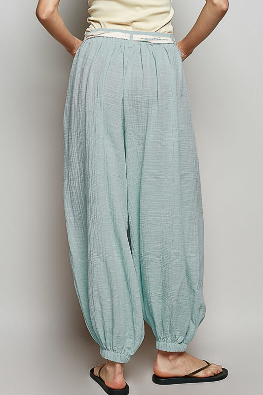 Light blue checkered pants worn by a person on a plain background