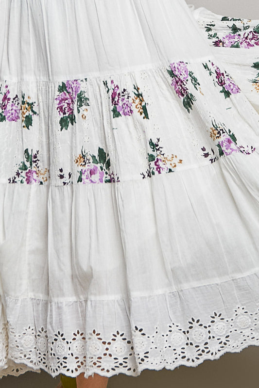 White dress with floral embroidery and lace details