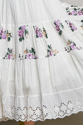 White dress with floral embroidery and lace details
