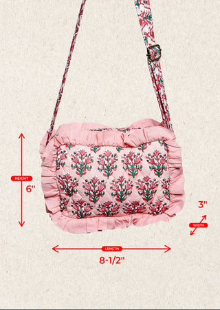 Pink floral shoulder bag with ruffled trim and a matching patterned strap, shown on a light beige background with red dimension arrows and labels indicating 6 inches tall, 8-1/2 inches wide, and 3 inches deep. The text 'SMQE67' appears in the top left.