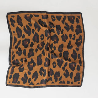 Leopard print fabric square on a white background