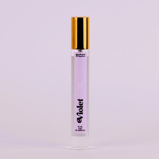 Perfume bottle labeled 'Violet' with a gold cap on a light gray background