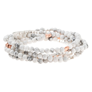 a beaded crystal wrap bracelet of necklace on a white background