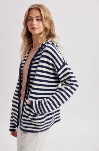 Women wearing a striped hoodie against a neutral background.