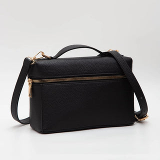 A black pebbled leather handbag with a top handle, a front zippered pocket, and a detachable shoulder strap, shown on a light gray background.