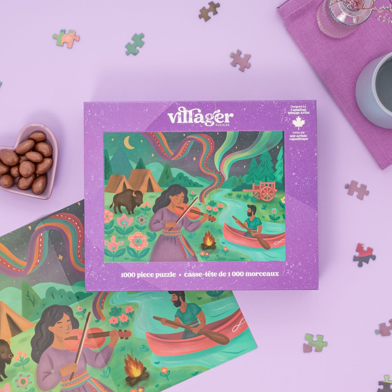Villager puzzle box with illustration of people by a campfire on a purple background