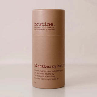 A cylindrical cardboard deodorant container labeled 'routine. natural deodorant' and 'blackberry butter' on a plain light background.