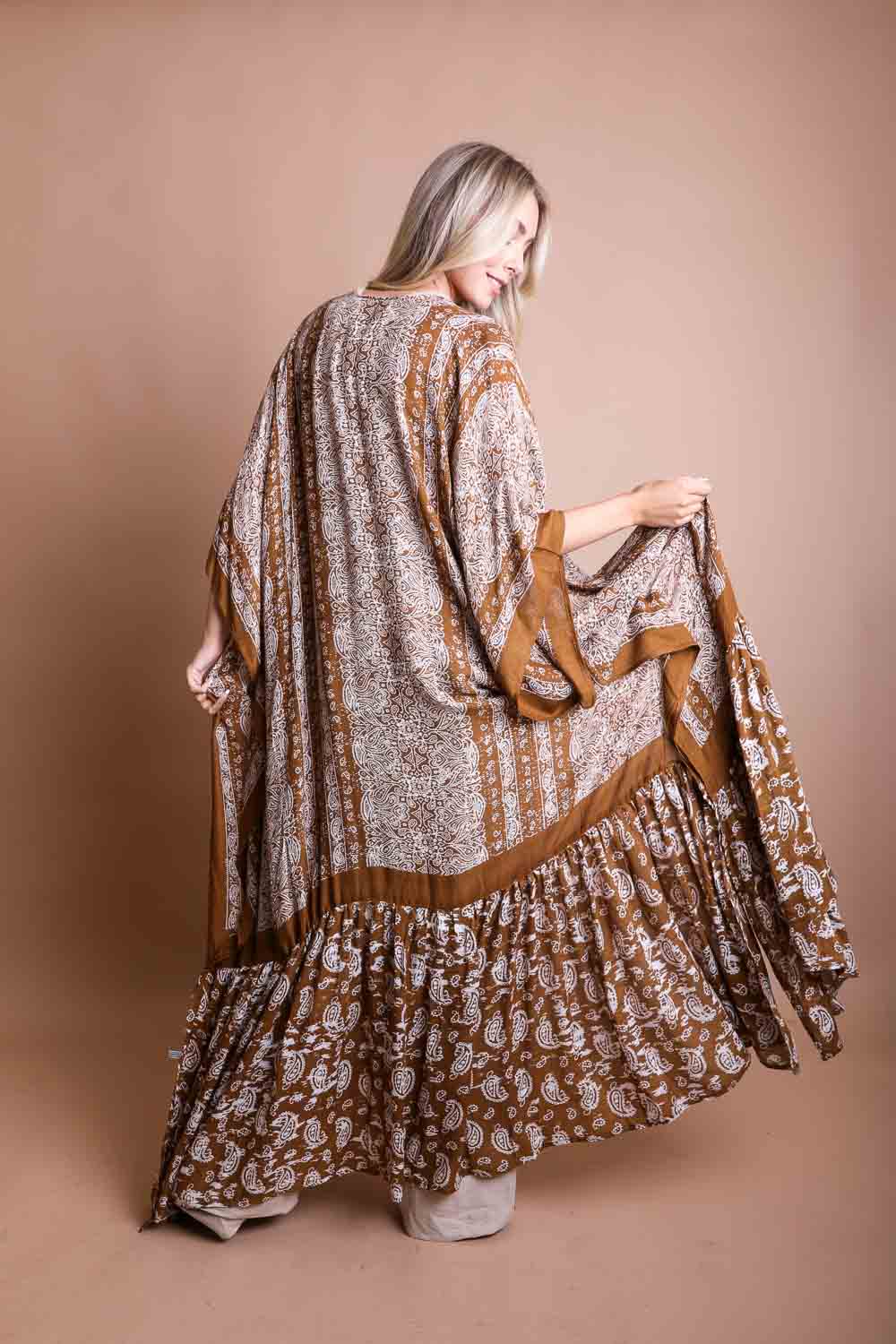 Women in long bohemian kimono shawl cover up