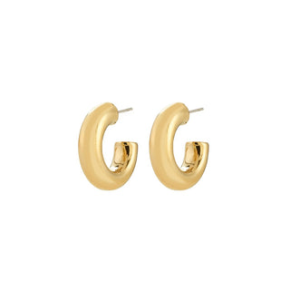 Gold hoop earrings on a white background