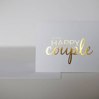 Greeting card with 'To the Happy Couple' text in gold on a white background