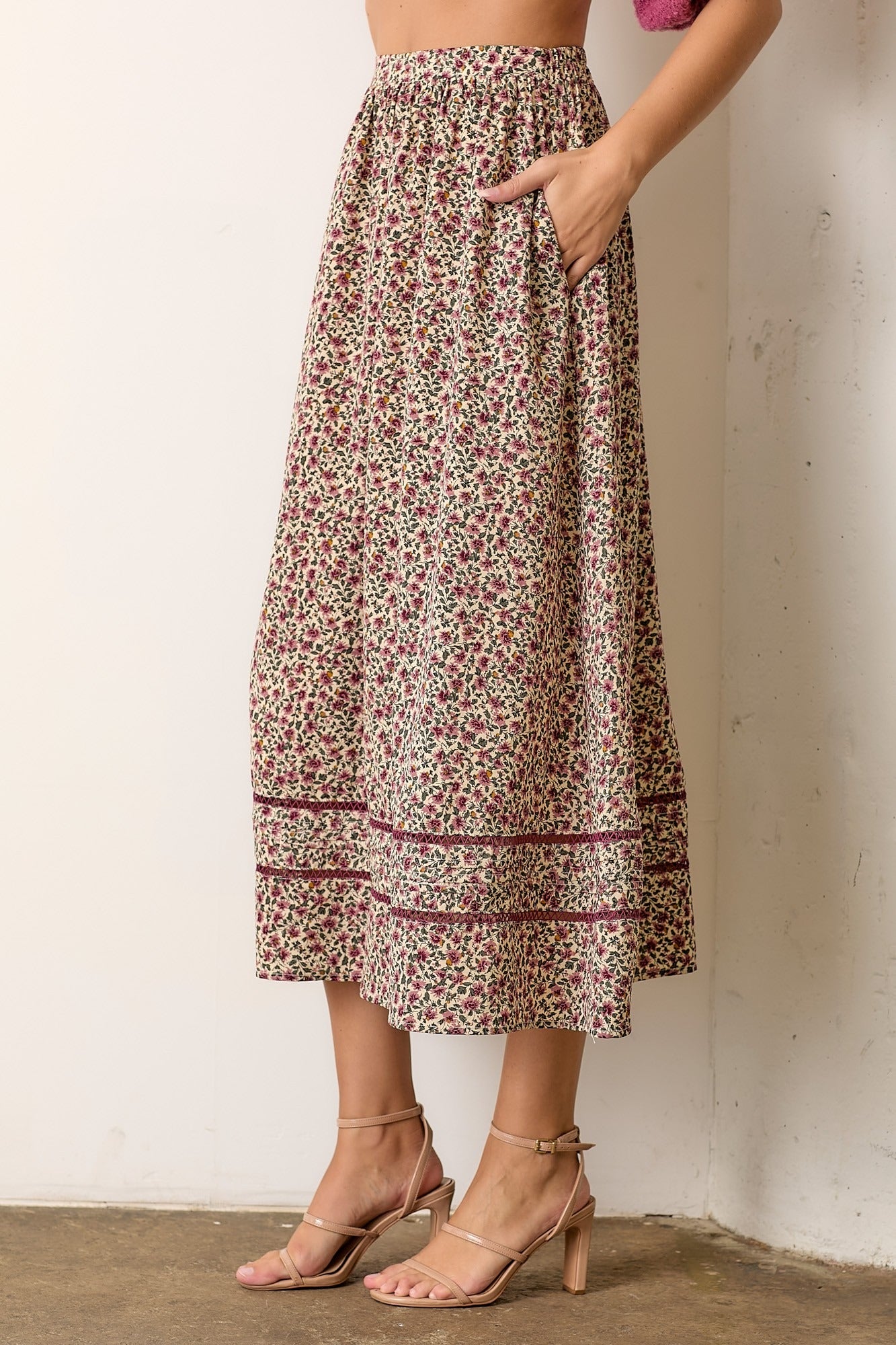 women wearing a floral pattern skirt and heels