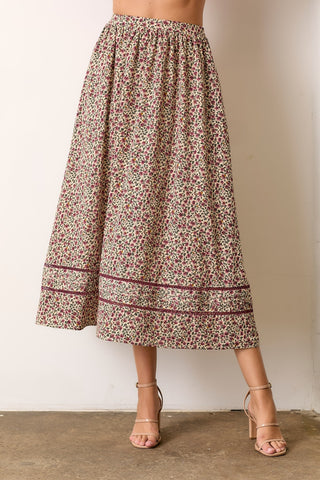 women wearing a floral pattern skirt and heels