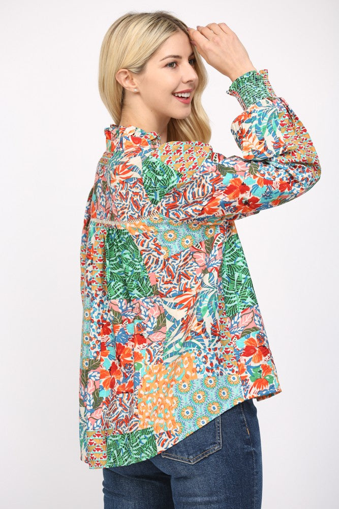 Women wearing a patterned blouse and blue jeans on a white background.
