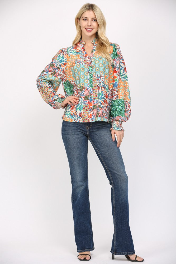 Women wearing a patterned blouse and blue jeans on a white background.